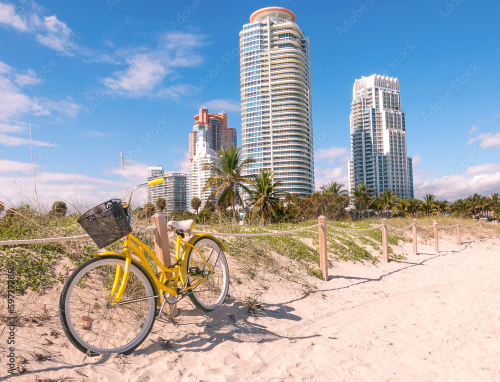 Single-speed bike leaning against a wooden split-rail fence on a beach somewhere below the Tropics of Capricorn