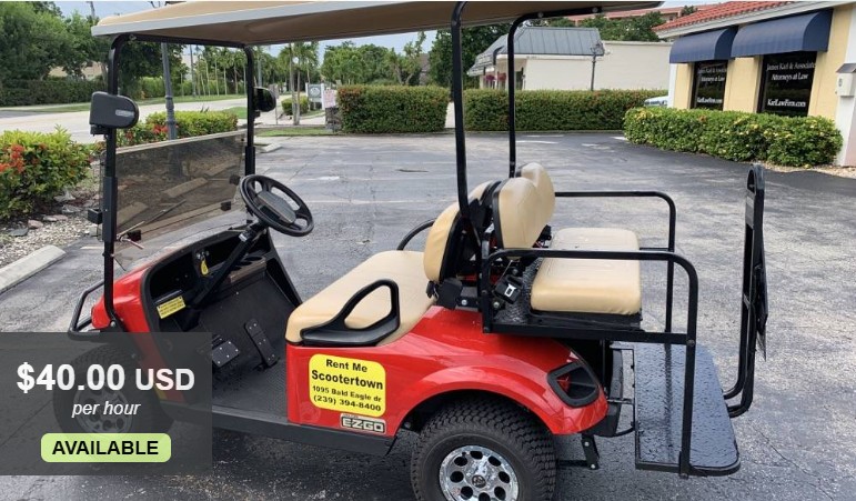 Image of a red 4-person golf cart