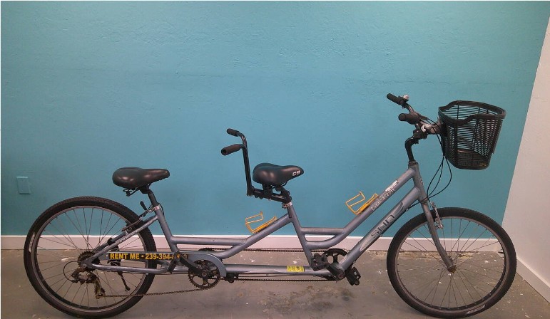 Image of a couple-ready tandem bike ready to roll out and explore Marco Island or Downtown Naples, Florida